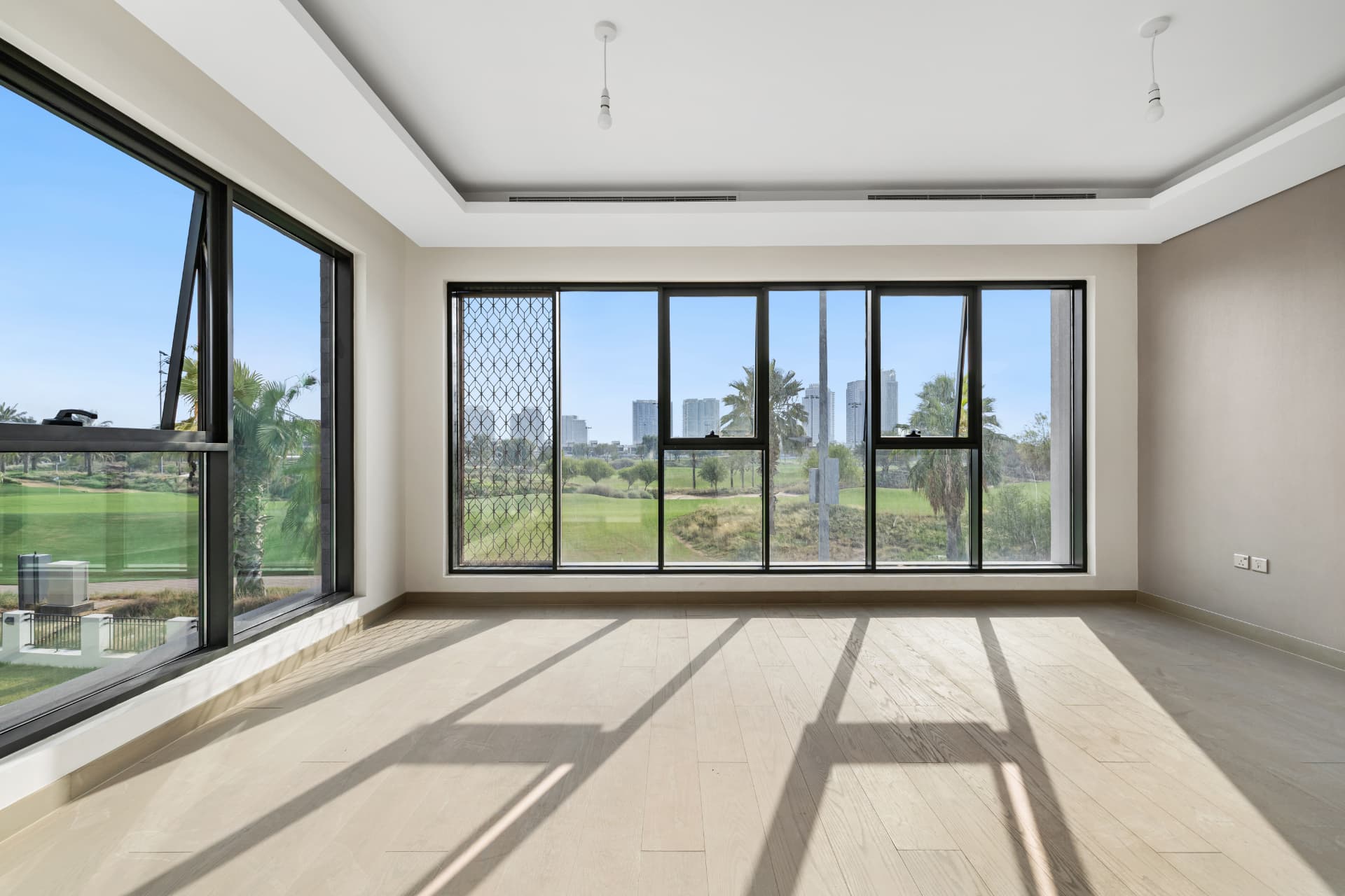 Full-height windows in the master suite of The Golf House